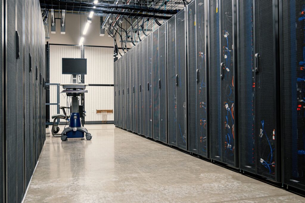 Futuristic server room with system administrator working on Linux terminal