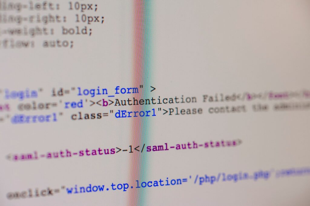 Web developer scrutinizing PHP code on computer screen with concerned expression