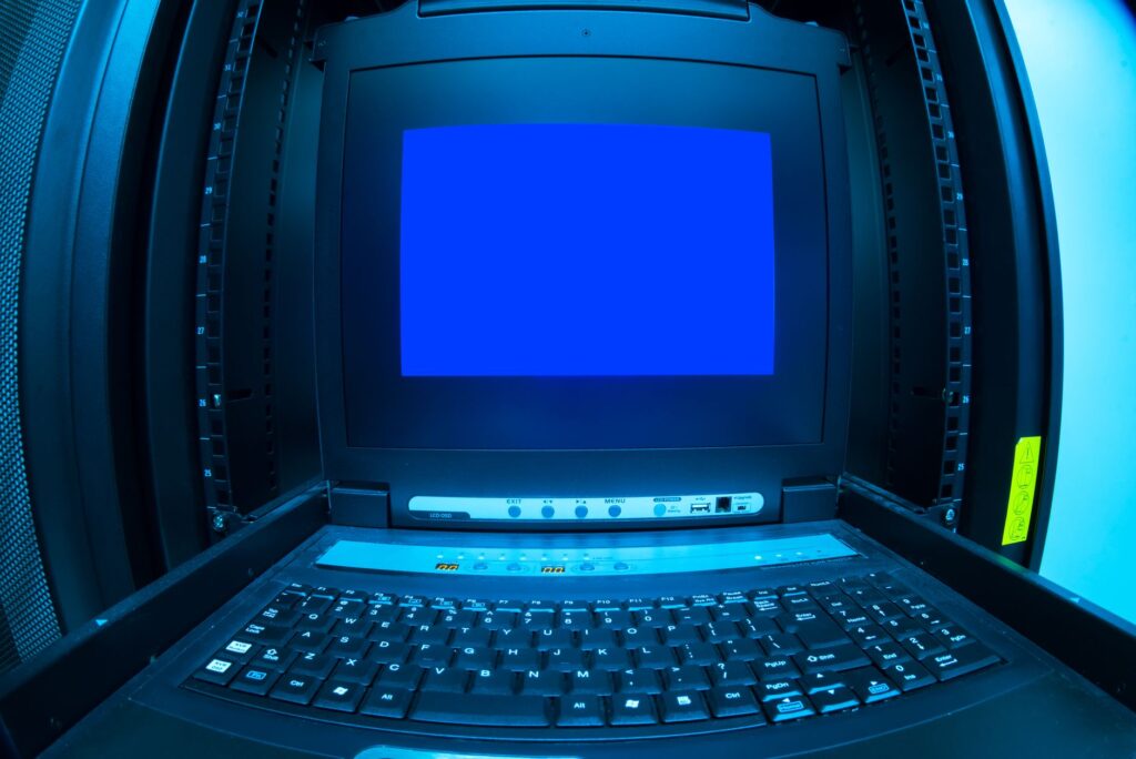 Dark terminal window showing PHP command-line text on monitor with abstract server racks and glowing blue network lines in background
